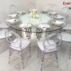 azzurra-round-glass-dining-table-and-acrylic-dior-chair-rental